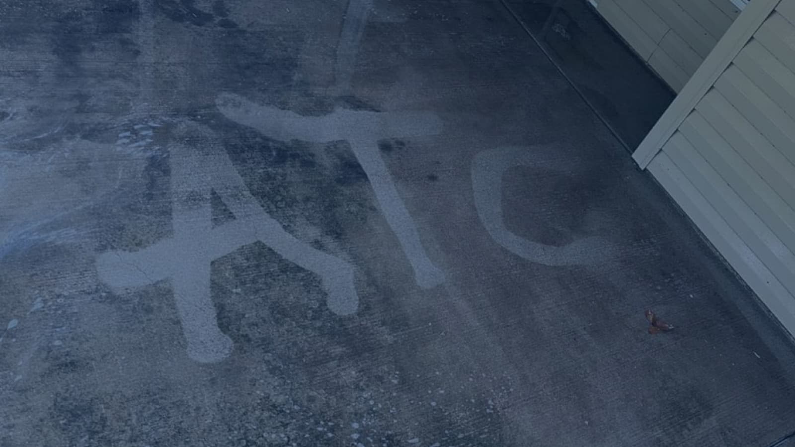 ATC lettering washed into a concrete driveway