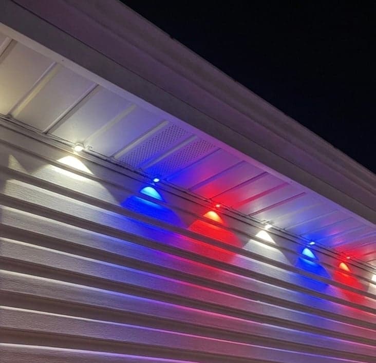 Colored Christmas lights along a home exterior
