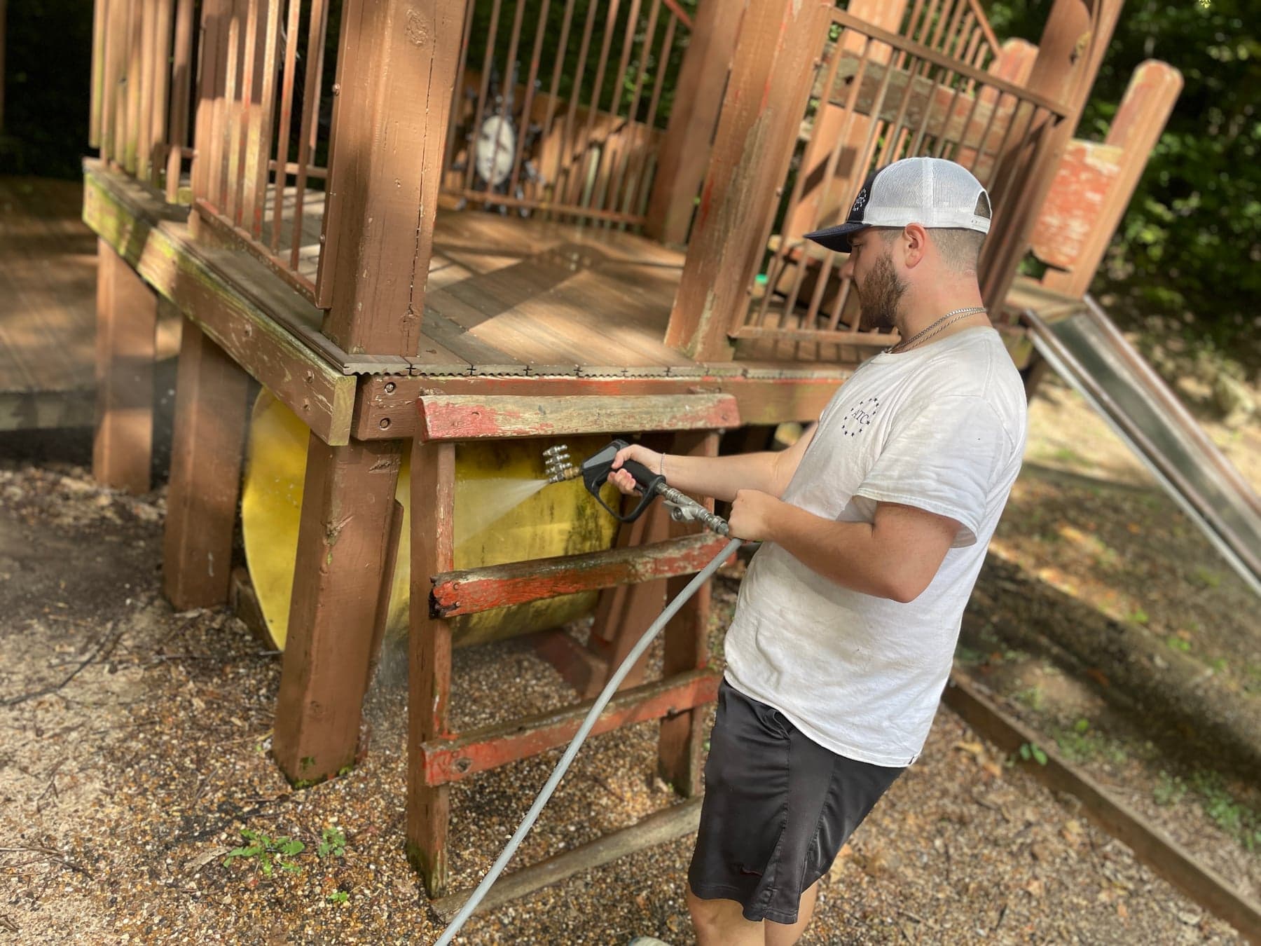 ATC cleaning an outdoor play structure